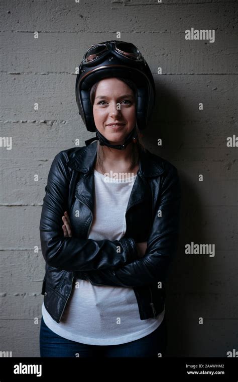 Portrait Of Smiling Young Biker Wearing Stock Photo Alamy