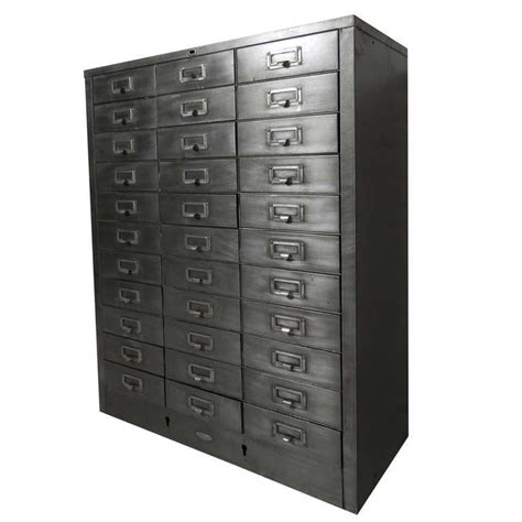 A filing cabinet (or sometimes file cabinet in american english) is a piece of office furniture usually used to store paper documents in file folders. Cole Steel Industrial Metal File Cabinet at 1stdibs