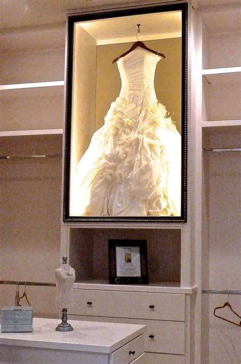 Https://tommynaija.com/wedding/framed Wedding Dress In Closet