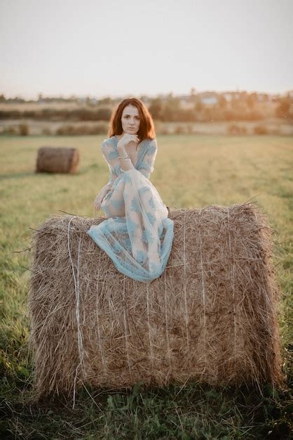 premium photo sexy girl in underwear posing on a haystack in summer at sunset in nature added