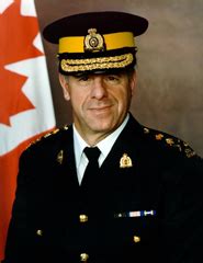 (image of two rcmp officers on a sidewalk, wearing masks, with a person on a bicycle and a person walking their dog.) (image of a rcmp officer wearing a mask standing next to his vehicle.) RCMP Get Second Crack at Own Scandal | The Tyee