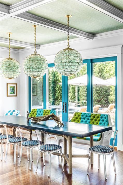 Whitewashed wood, rope accents, rattan legs, and cane backing are just a few examples of modern coastal furniture elements. coastal dining room | Evolve Residential | Dining Rooms ...