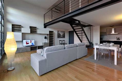 Our one bedroom loft apartments feature a living room with a fireplace, kitchen with dishwasher, separate dining room and a powder room on the lower level. Garden loft apartment | Heart Milan Apartments