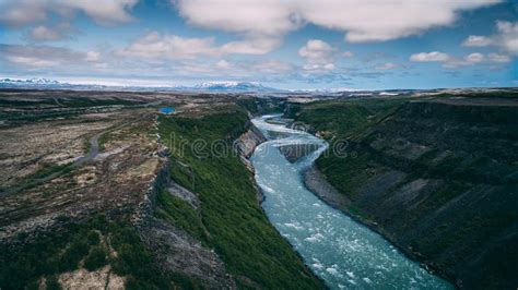 Aerial View Of River Flowing Trough Cliffs In Iceland Stock Image