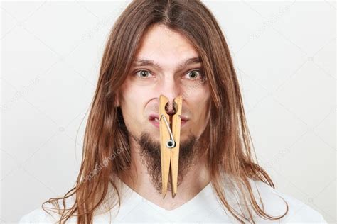 Man With Clothespin On Nose Stock Photo By ©voyagerix 103378330