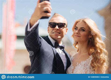 Groom And Bride Make A Selfie On Smartphone Stock Photo Image Of