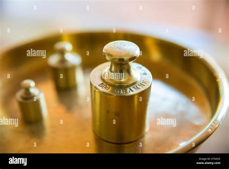Weights On A Golden Weighing Scale Stock Photo Alamy