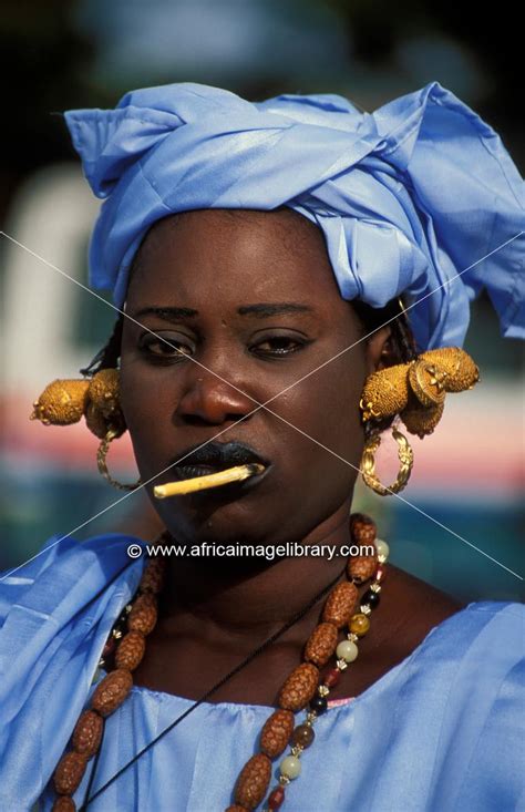 Photos And Pictures Of Wolof Woman Wearing A Traditional Blue Dress