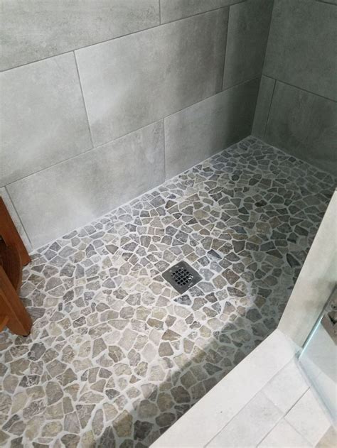 Affordable Stone Tiles Designs For Bathroom Shower 08 Pebble Tile