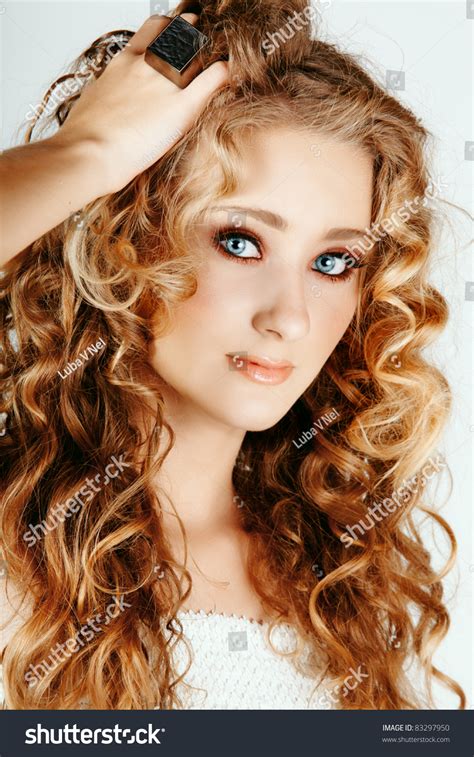 Beautiful Strawberry Blond Woman With Blue Eyes And Long