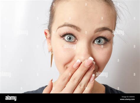 Young Girl Covering His Mouth With His Hand Stock Photo Alamy