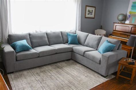 In fact, the breens' home is decidedly happy, thanks to its crisp white trim and many splashes of vibrant color. creative space // grey sectional | Home decor, Grey ...