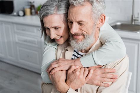 Smiling Woman Hugging Mature Husband In Stock Image Image Of Wife