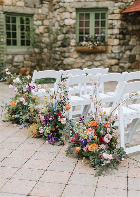 this wildflower wedding uses pressed florals and lush arrangements to create a gorgeous setting