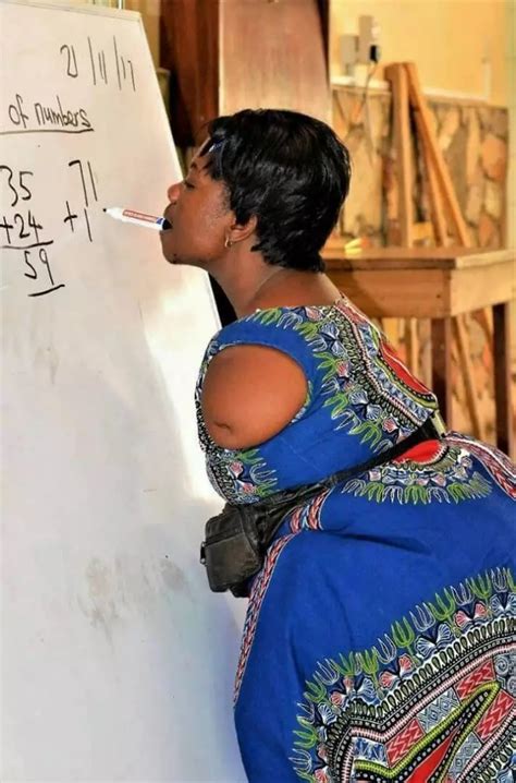 Photo Of Armless Teacher In Ghana Teaching Math And Writing With Her