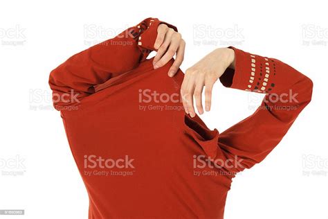 Funny Woman Takes Off An Orange Shirt Stock Photo Download Image Now