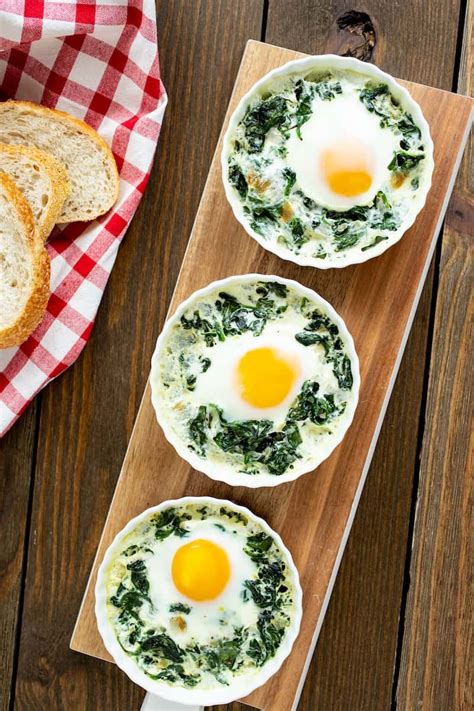 Chocolate, cream cheese, whipped cream and a buttery biscuit base all make for the. Baked Eggs in Ramekins with Spinach and Cream | Recipe ...