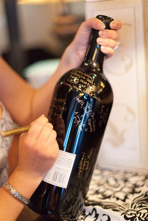 Decorate your wedding centerpiece with our handmade wedding guest book! Wine Bottle Guest Book