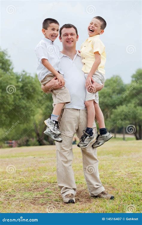 Happy Father Carrying His Two Son In His Hands Stock Image Image Of