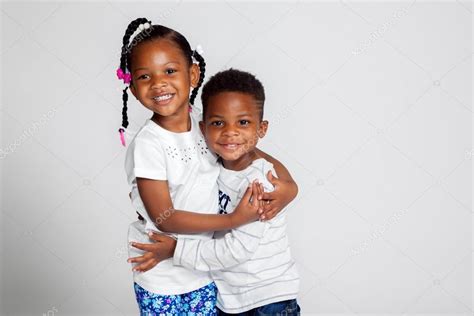 Young African American Siblings Hugging Stock Photo By ©jbrown777 119032944