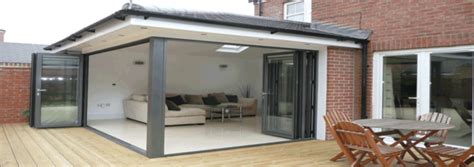 This garage conversion blends a home office and a small seating area complete with a couch for guests. Garage Conversions Liverpool and Merseyside - INSTANT QUOTE