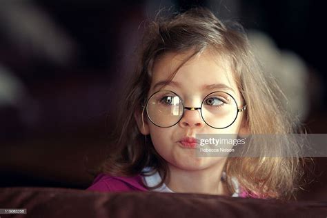 Girl Wearing Glasses With Pursed Lips Photo Getty Images