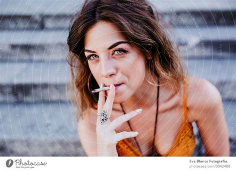 Beautiful Caucasian Woman Smoking Cigaretteurban Lifestyle A Royalty