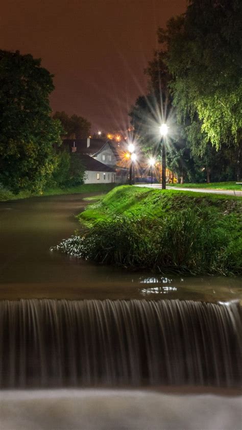 Landscape Photo Of Waterfall River During Nighttime With Street Light