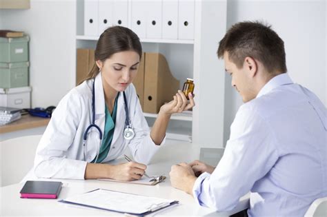 Female Medicine Doctor Prescribing Pills To Her Male Patient Luminis