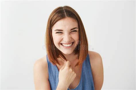 Portrait Of Cheerful Happy Young Beautiful Girl Laughing Smiling Over White Background Stock
