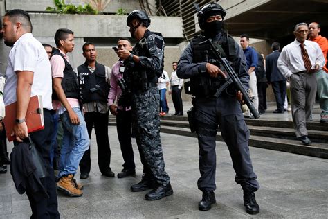 Police Officers And Security Personnel Stand Outside Venezuelas