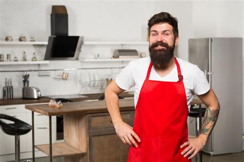 Premium Photo Mature Male Bearded Man Cook Bearded Man In Red Apron Restaurant Or Cafe Cook