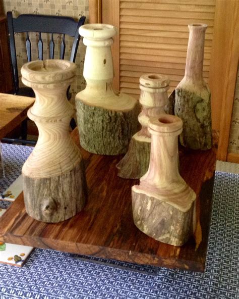 Four Vases Are Sitting On A Wooden Tray
