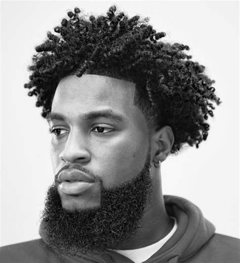 fade hairstyles for black men with poneytail wavy haircut