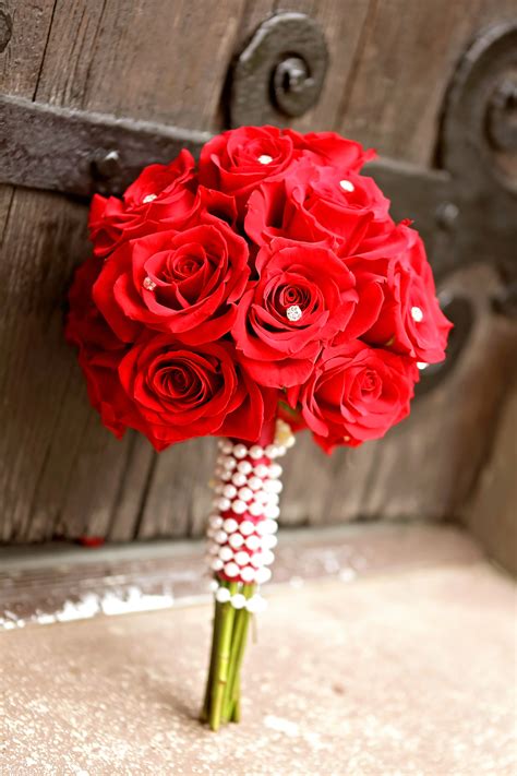 Brittany Carried A Solid Red Rose Bouquet Wrapped With A Strand Of