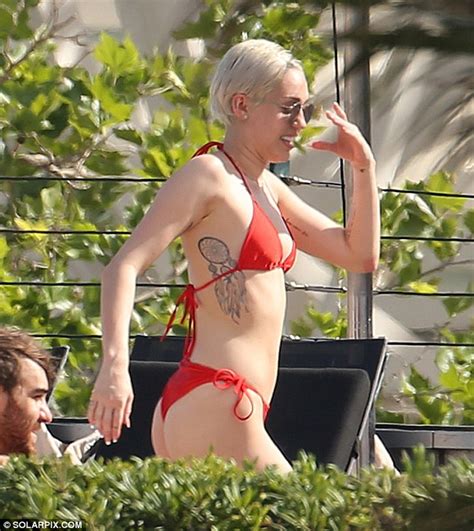 Miley Cyrus Shows Off Toned Figure In Red Bikini While