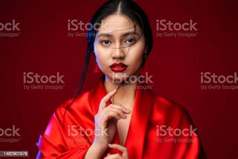 beautiful japanese girl in red silk kimono dress asian beauty woman face with red lips makeup