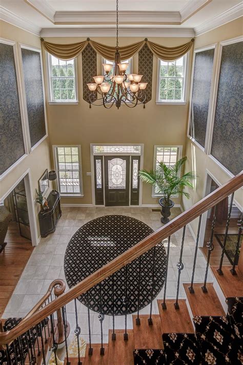 Grand Foyer Boasts Lofty Ceiling And Elegant Chandelier Hgtv