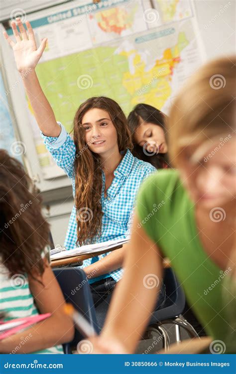 Female Pupil Answering Question In Classroom Stock Photo Image Of