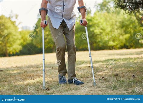 Old Man Walking On Crutches Stock Photo Image Of Garden Crutch 80276170
