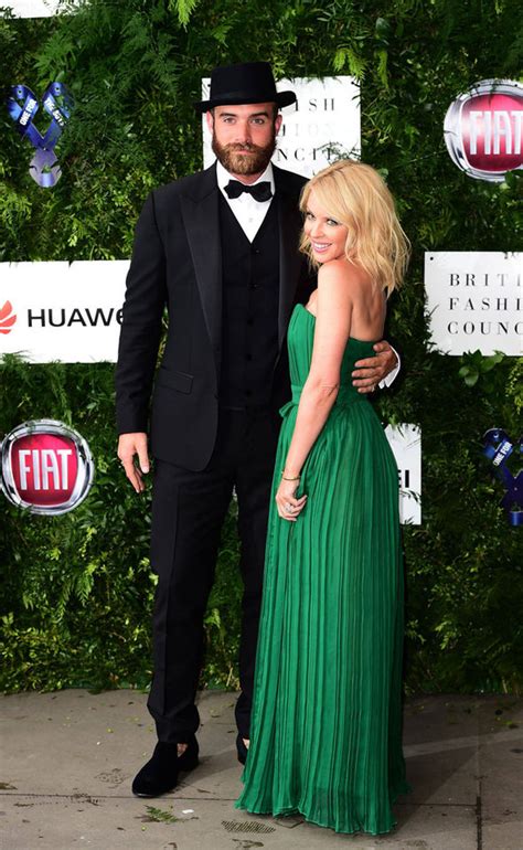 Kylie Minogue turns heads in glamorous gown as she cosies up to fiancé