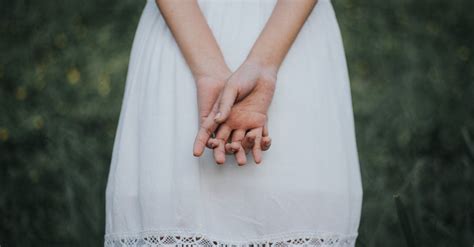 Back View Of Woman In White Dress With Clasped Hands · Free Stock Photo