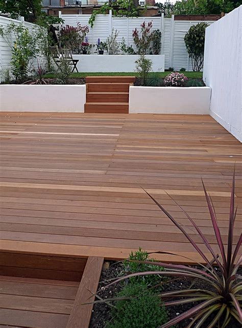 As a result, today's gardens are all too often ecological nightmares. Garden design Clapham Balham decking white fence low ...