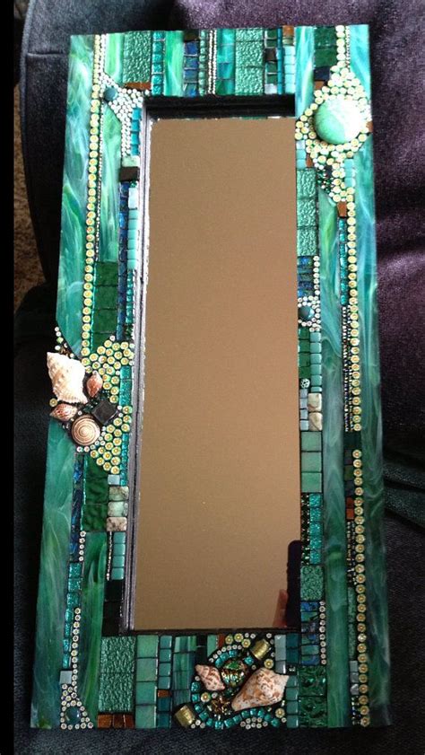 I trimmed the mosaic tile sheets in 5 piece strips and used push pins to hold it on the wall to form a template and then marked the outline of where the mirror would go with a pencil. Mosaic Mirror … | Mosaic mirror frame, Glass mosaic mirror ...