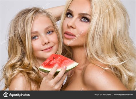 Beautiful Blonde Female Model Mother With Blonde Daughter Hug They Hold Watermelon And Cheer