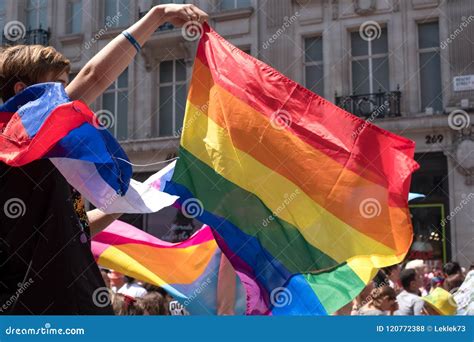 Onlooker Celebrating And Waving Lgbt Rainbow Flag During The Gay Pride Parade London 2018