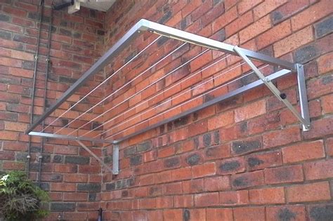 Diy foldable clothes drying rack. Aluminium wall mounted fold down washing lines. For both ...