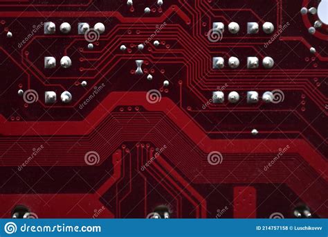 Red Computer Motherboard Chips Close Up With Contacts Stock Photo