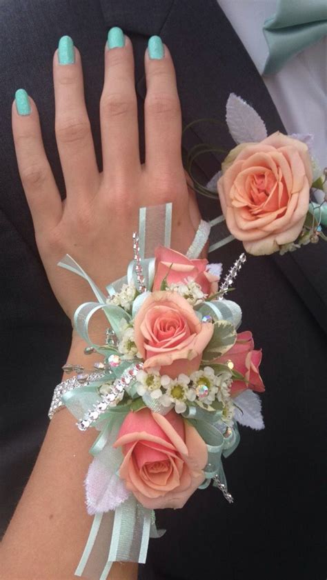 beautiful corsage and matching coral and mint boutonniere prom flowers corsage wrist corsage