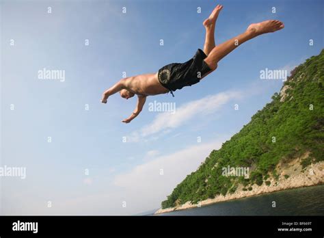 Man Jumping Into Sea From Boat Hi Res Stock Photography And Images Alamy